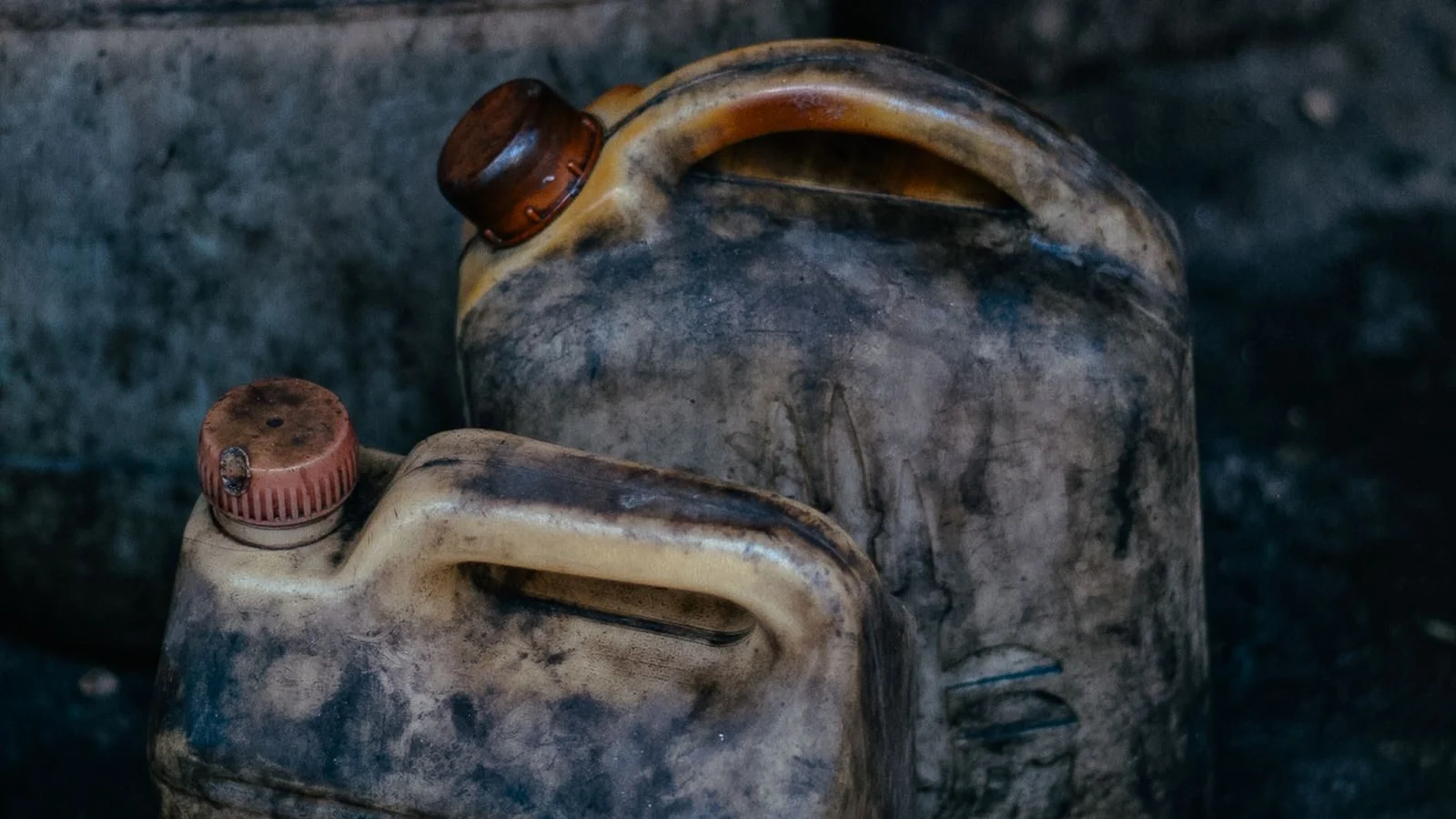 Old metal fuel canisters in a workshop