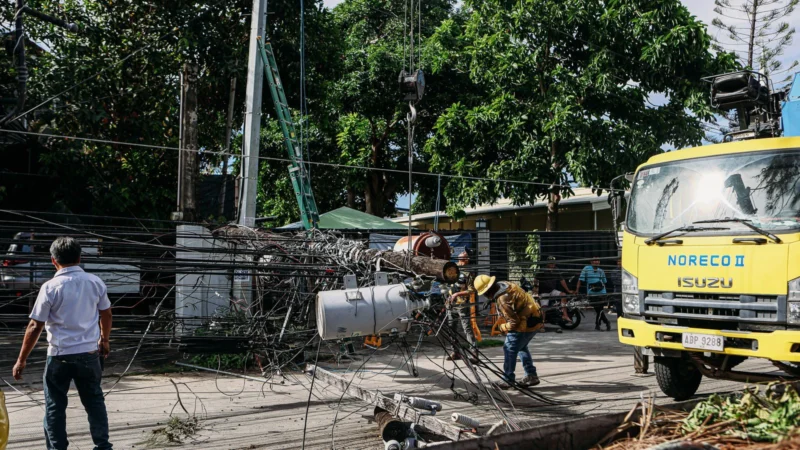 Utility crew in hard hats repairing power lines