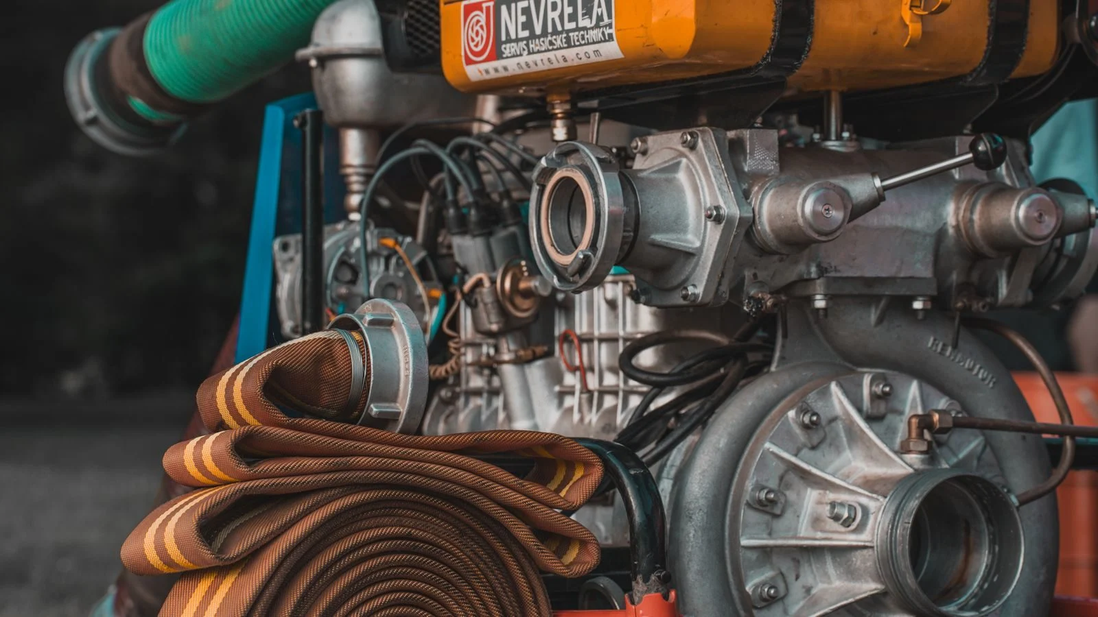 Engine-driven pump with a coiled suction hose